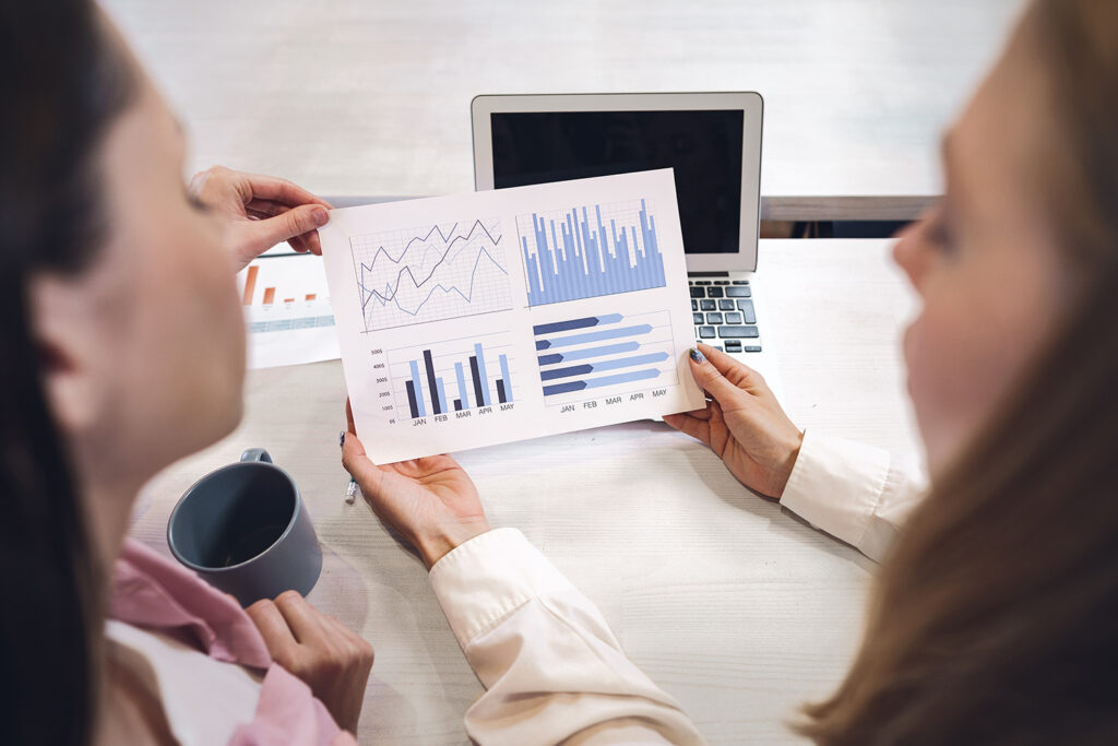 Two women discussing the Product metrics